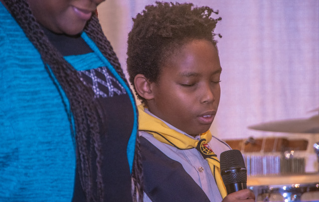 Young boy praying.